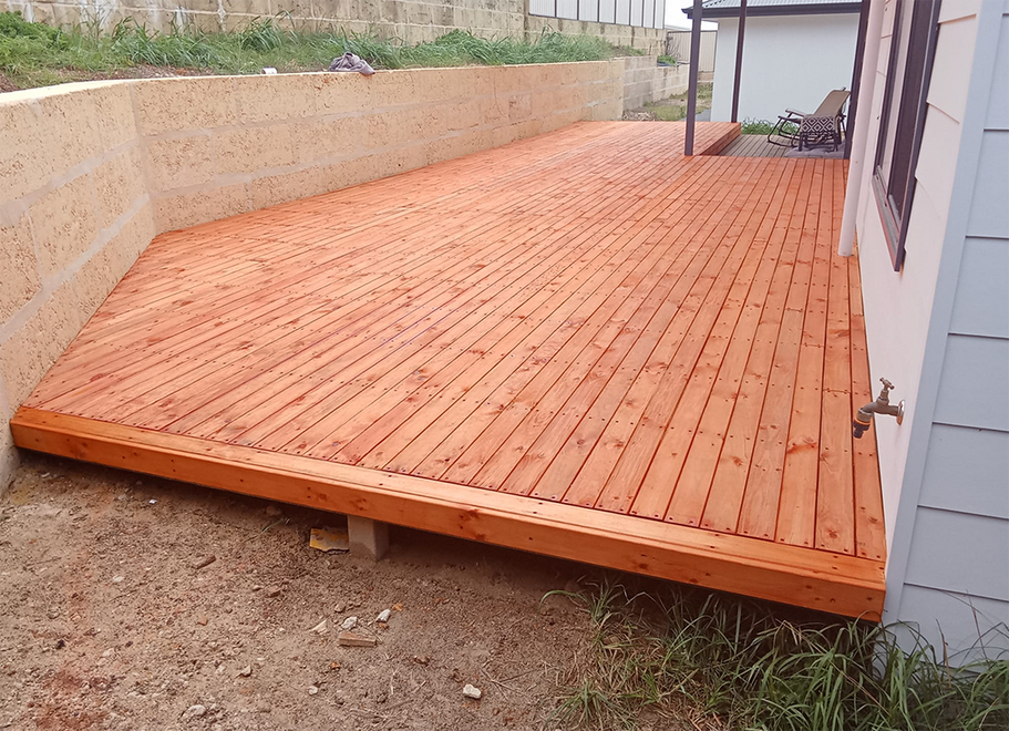 A spacious outdoor timber deck with natural wood finish