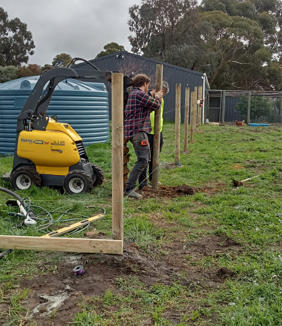 Structural post installation for outdoor fence project in Albany WA by local carpenter.