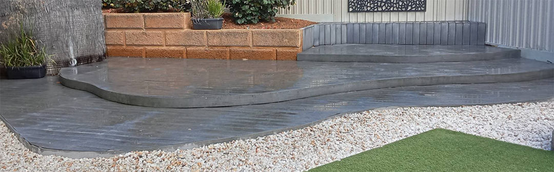 Curved concrete pathway with gravel edging installed at Albany WA property.