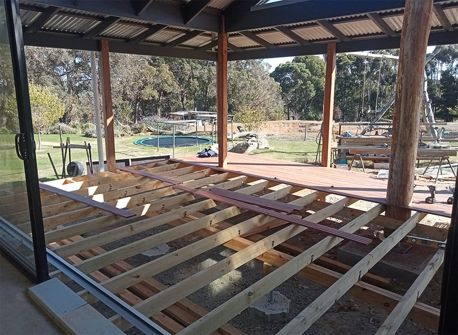 Large timber deck framing under pergola built by Albany carpenter.